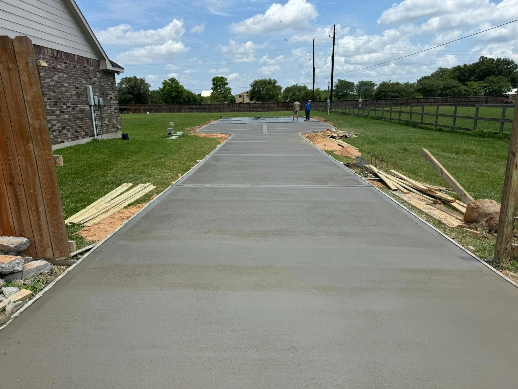 Long concrete driveway Fort Bend County